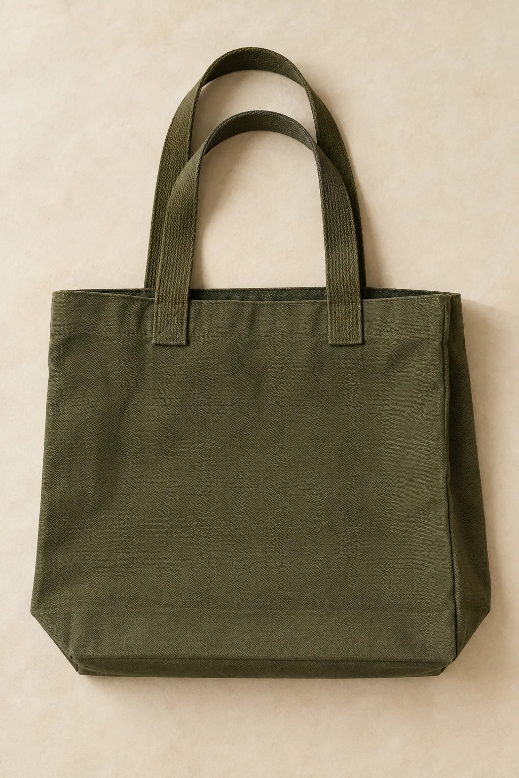 Olive canvas shopper with shoulder handles, side gussets and a boxed base