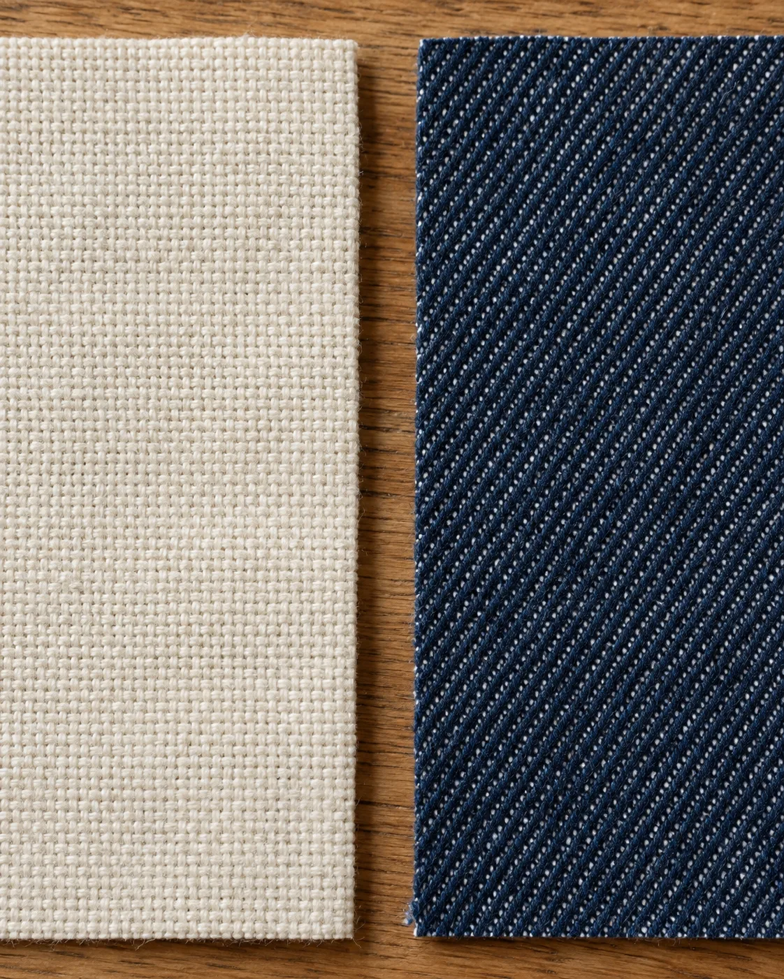 Ecru canvas with a square yarn grid on the left, beside indigo denim with diagonal lines on the right