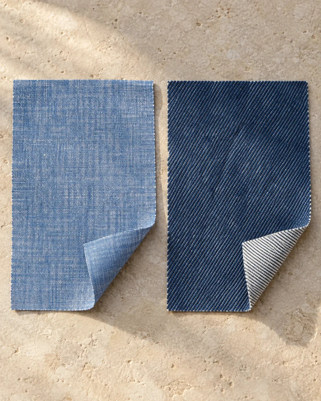 Blue chambray on the left and dark blue denim on the right, with corners turned back