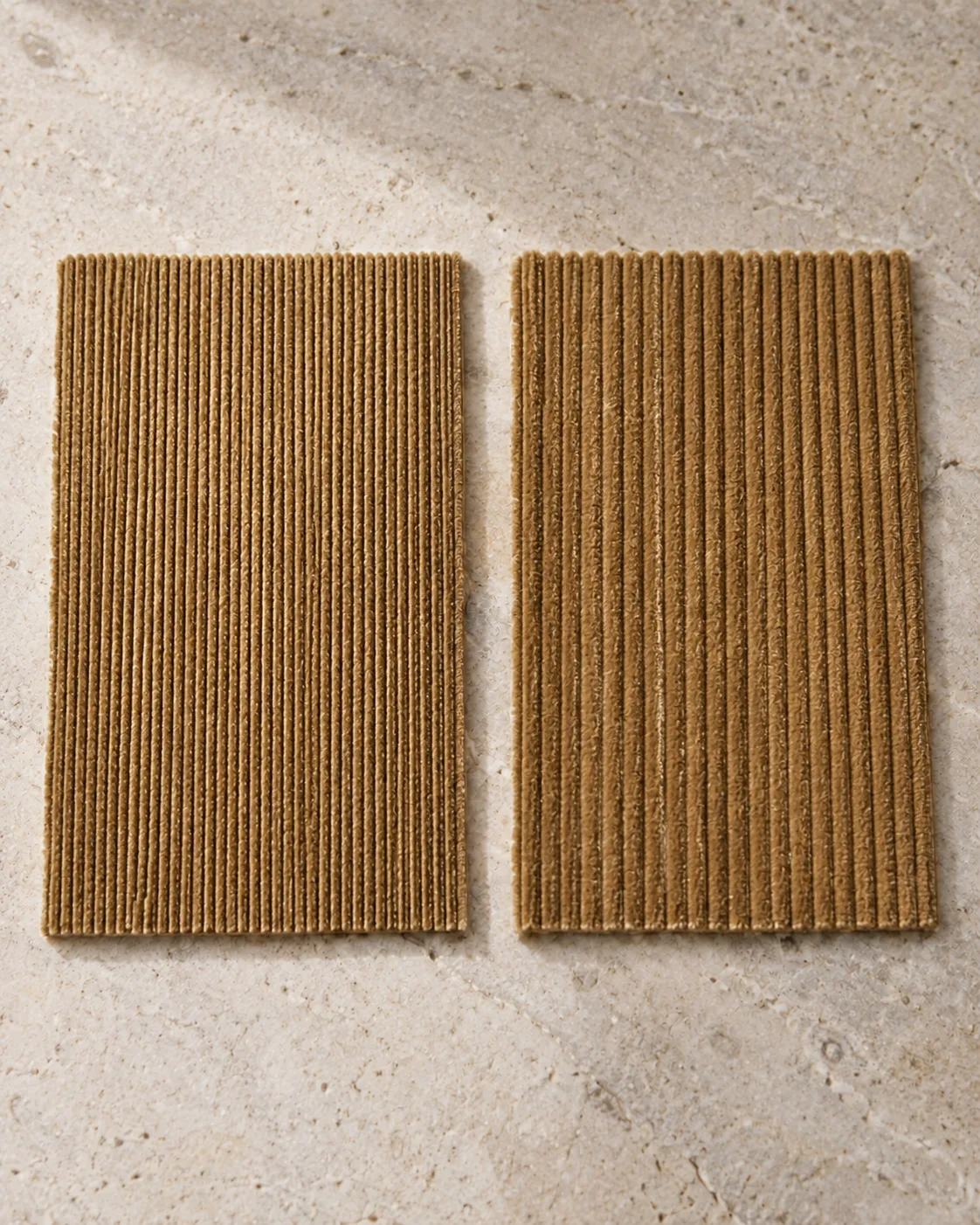 Two tan corduroy swatches: fine pinwale on the left, broader wide-wale ribs on the right