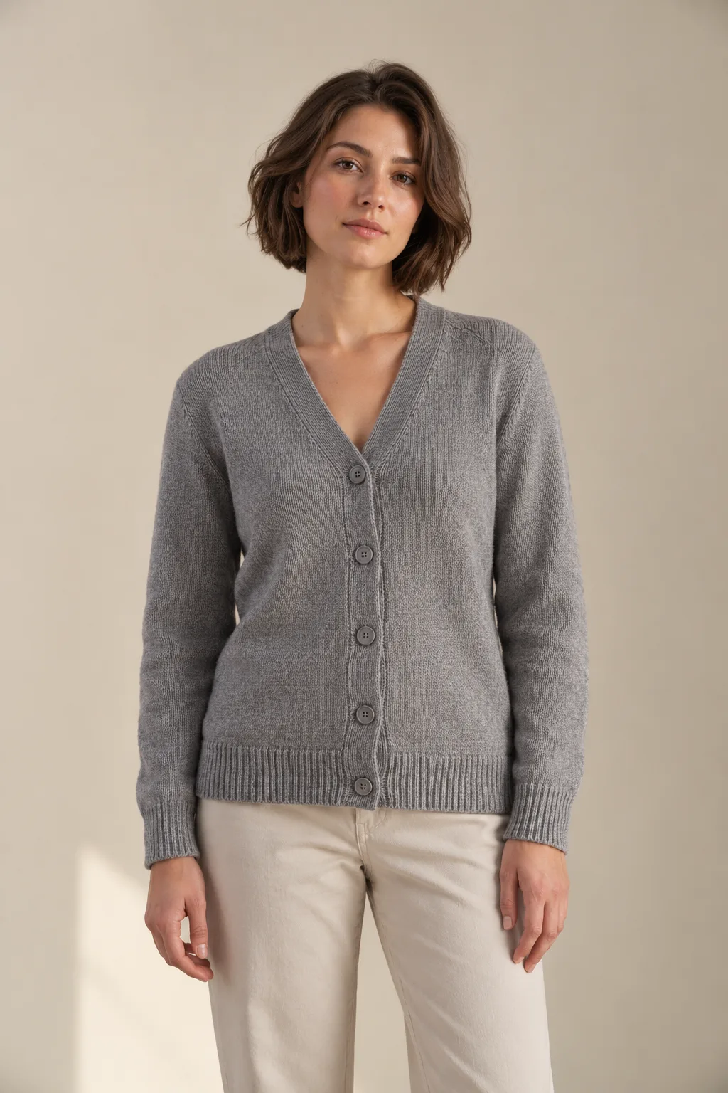 Grey V-neck cardigan with buttons and ribbed cuffs