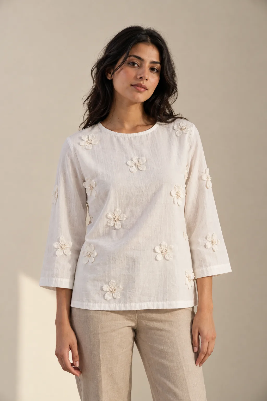 White top with fabric flower appliqués