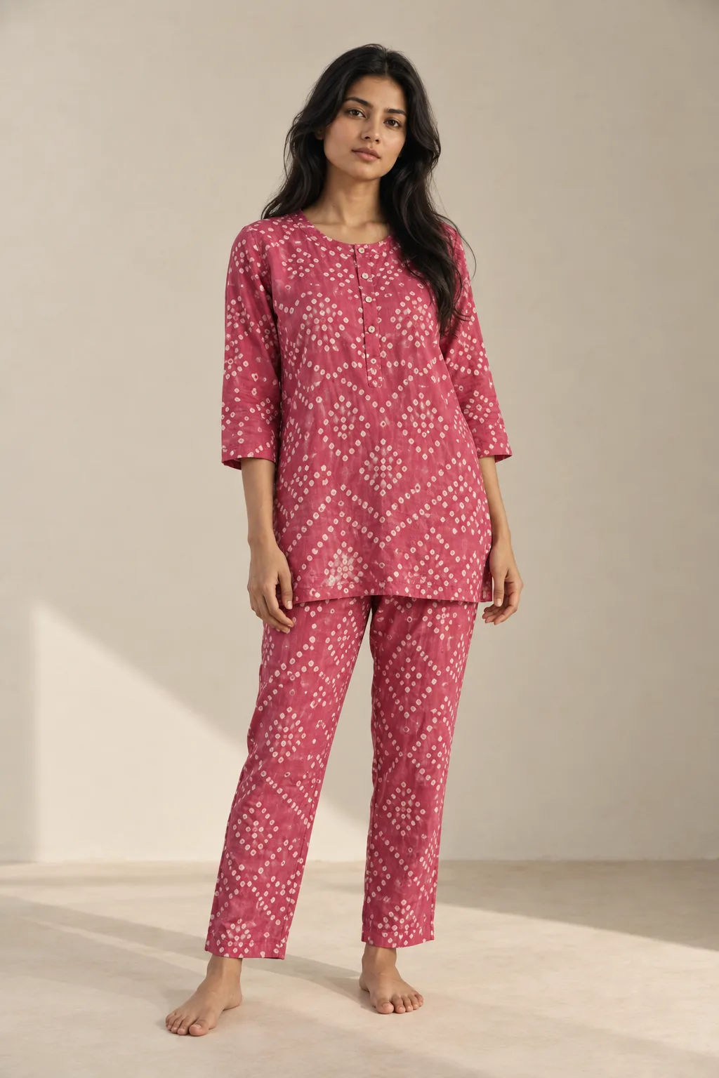 Pink bandhani top and trousers worn as a set