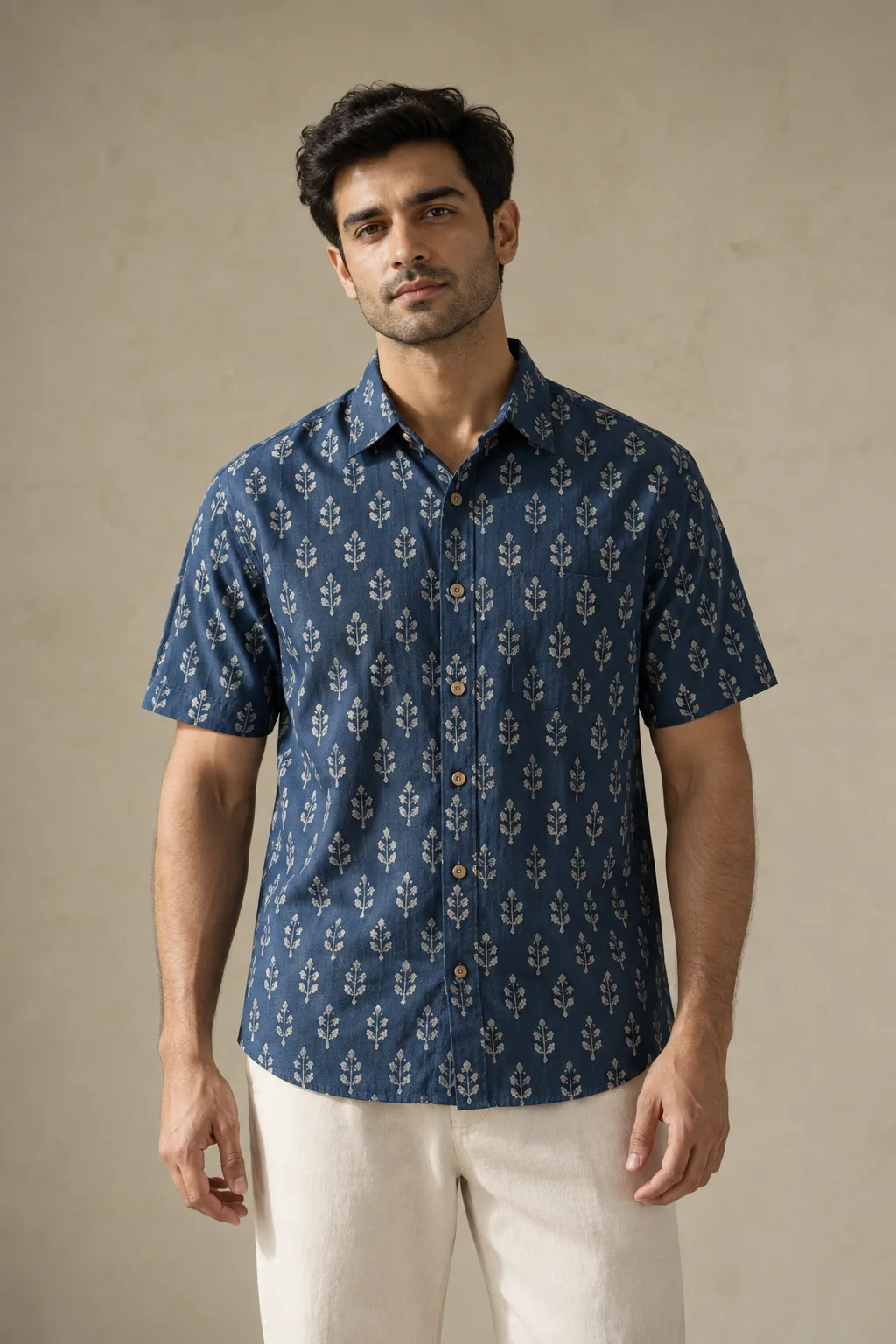 Indigo short-sleeve cotton shirt with a small pale botanical repeat