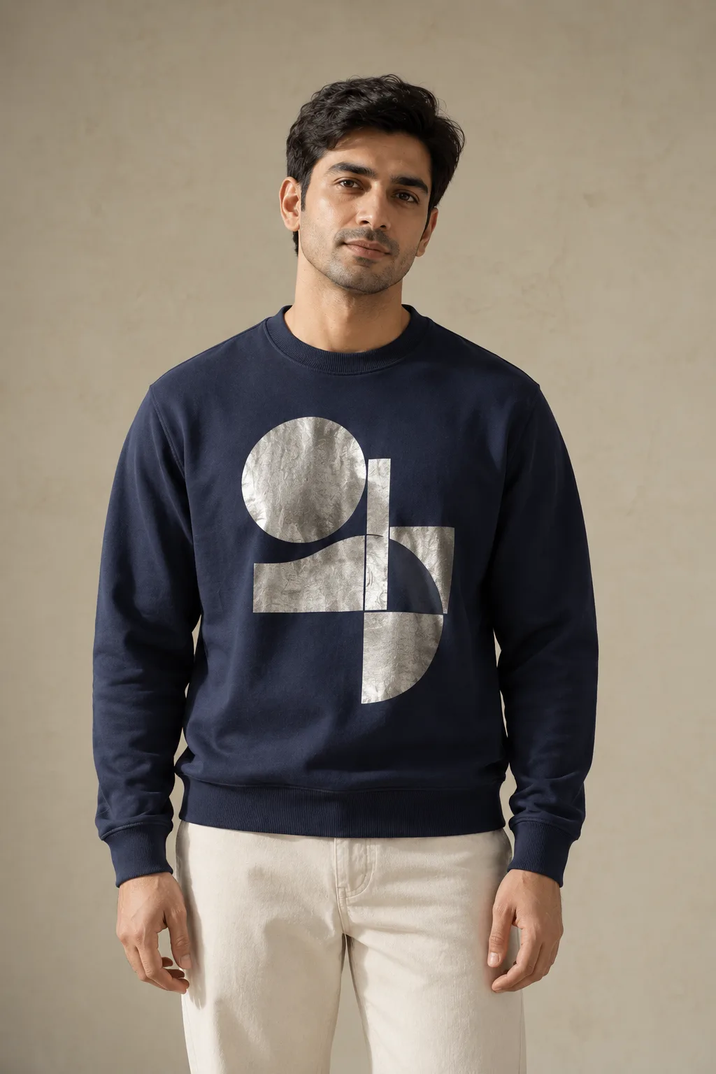 Navy sweatshirt with a geometric silver foil print on the chest