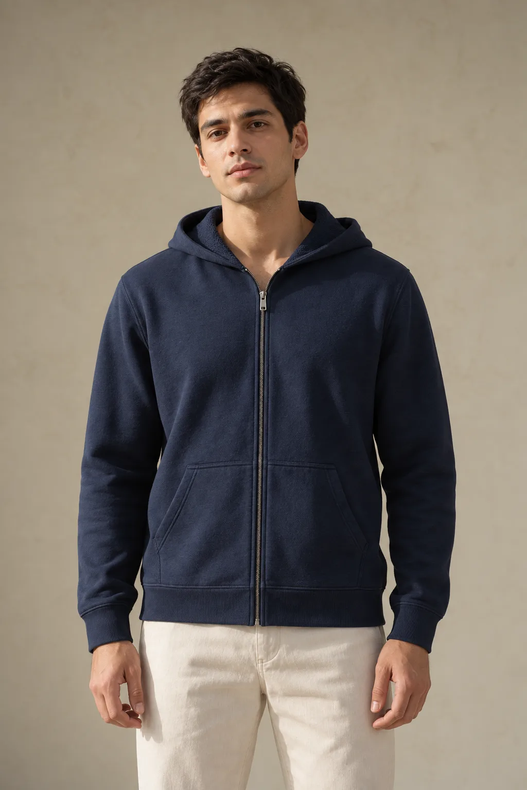 Man wearing a navy French terry zip hoodie