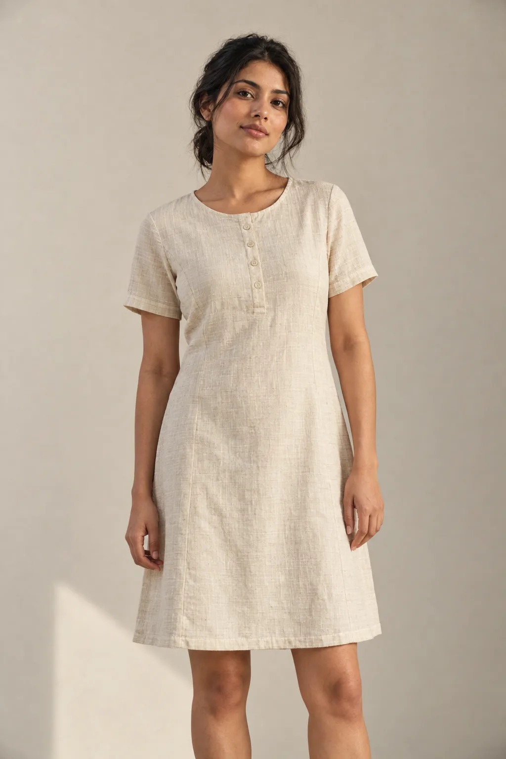 Ecru short-sleeve dress with a short button placket