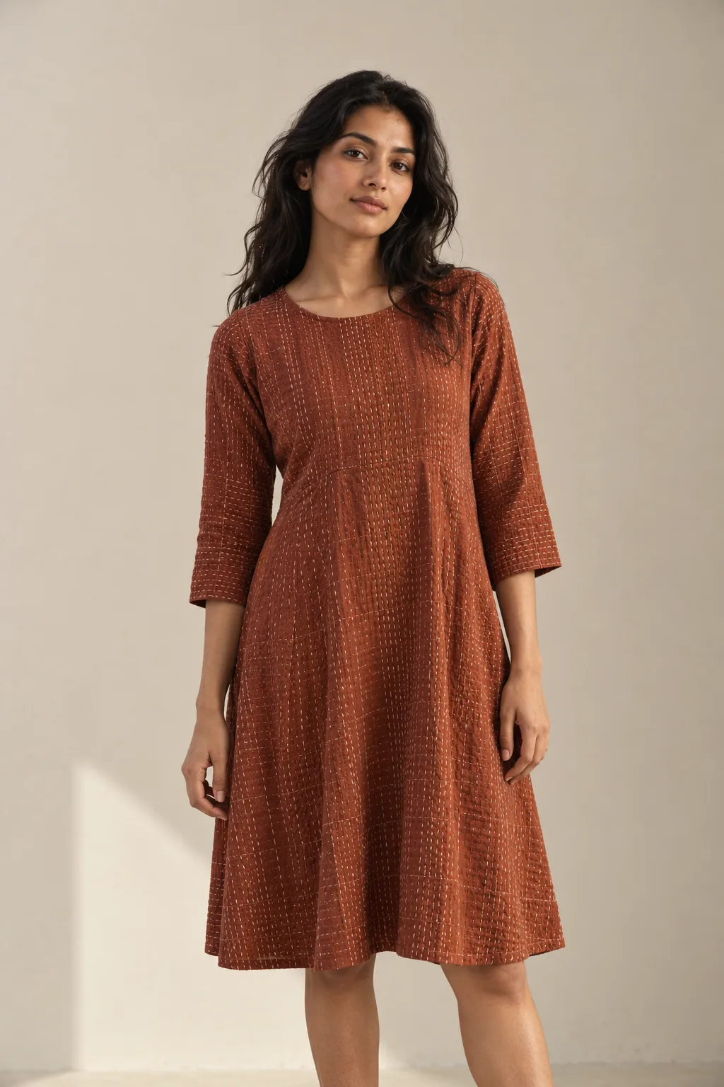 Rust dress with cream Kantha running-stitch rows