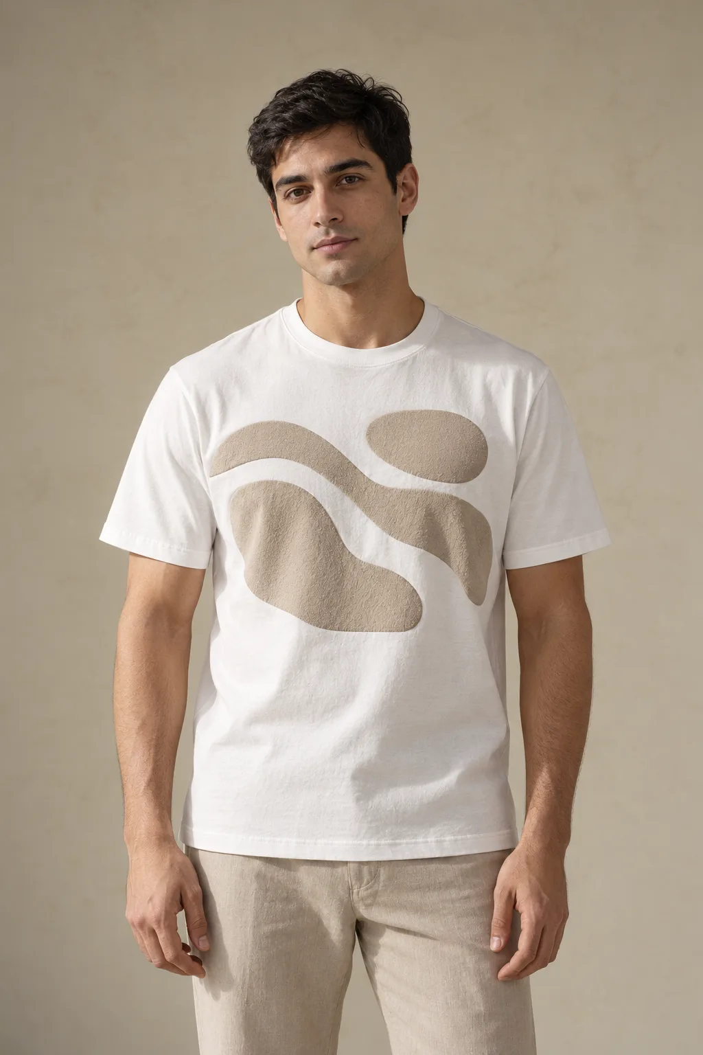White T-shirt with large raised abstract shapes in beige puff print