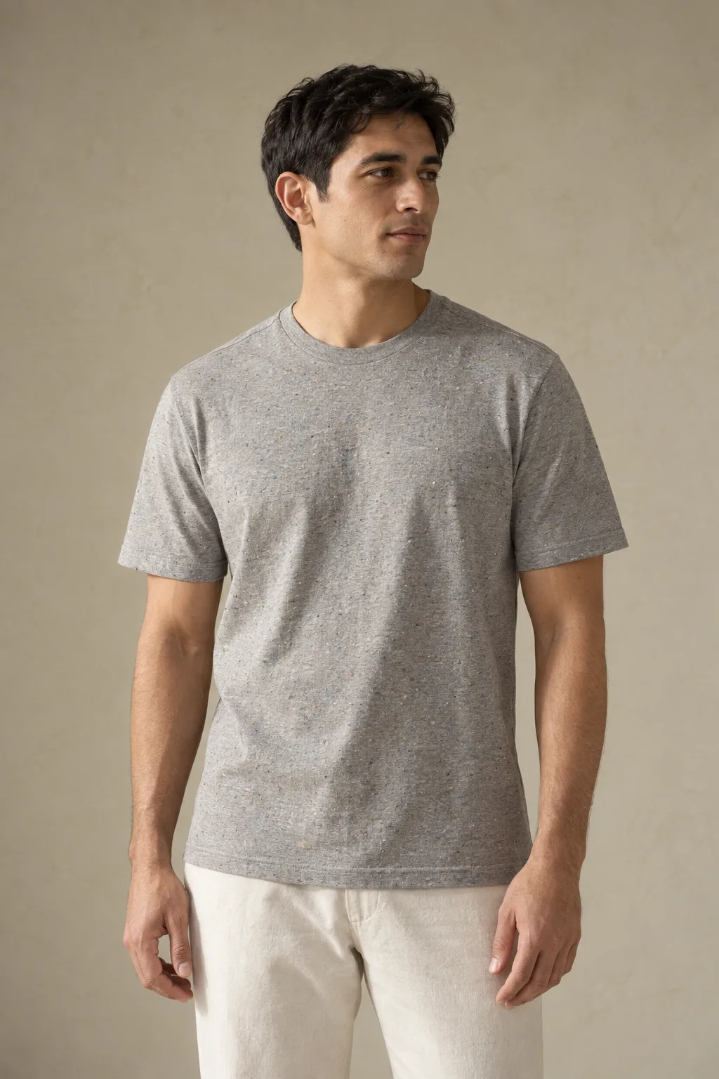 Man wearing a grey flecked short-sleeve T-shirt