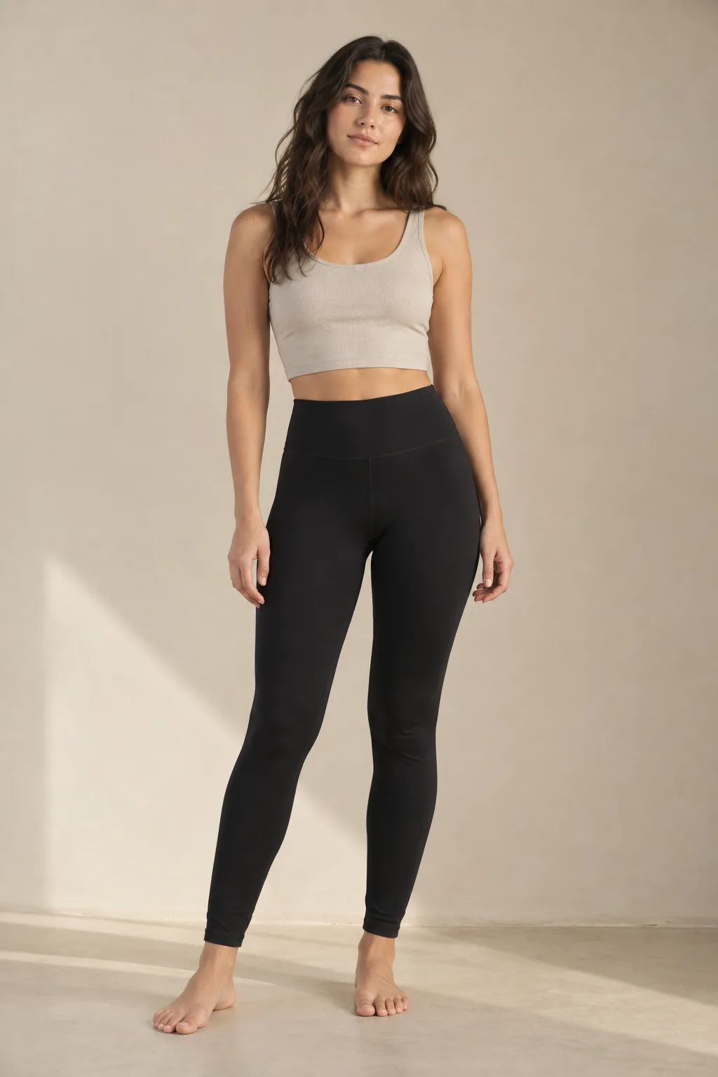 Woman wearing black high-waisted leggings