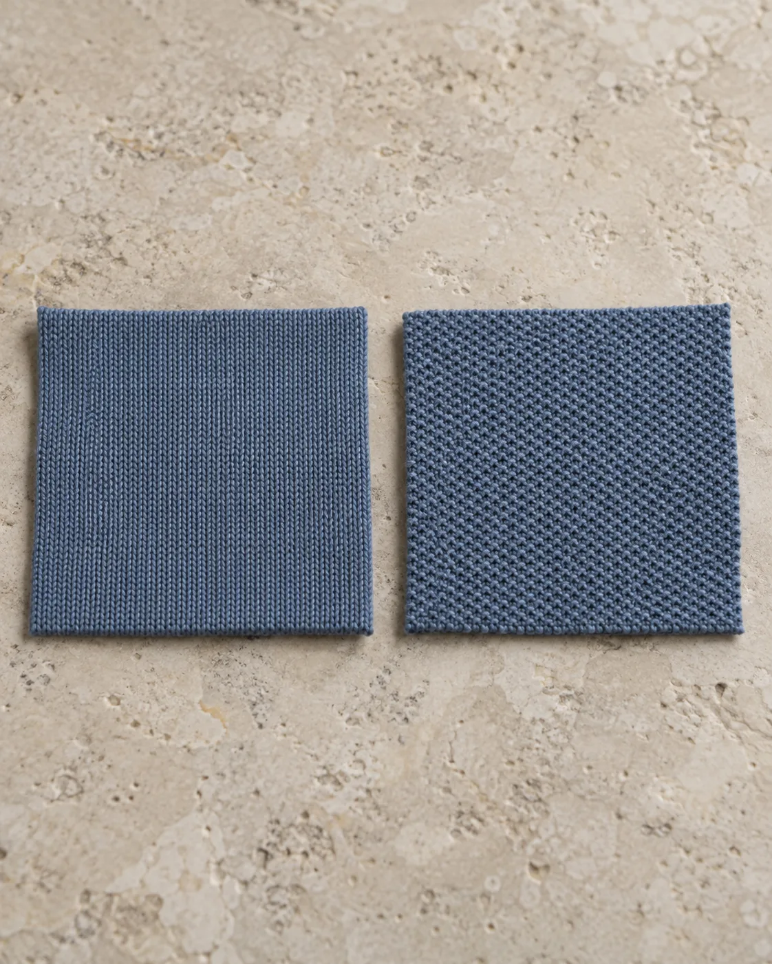 Two slate-blue knit swatches, smooth single jersey on the left and fine cellular piqué on the right