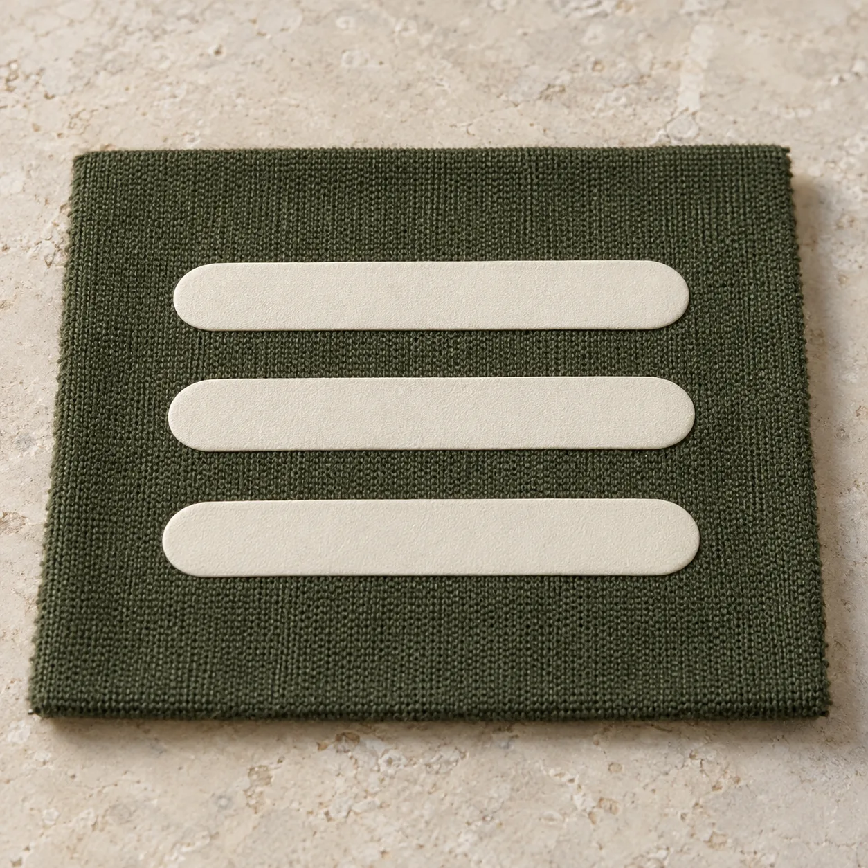 Olive fleece swatch with three ecru raised printed bars